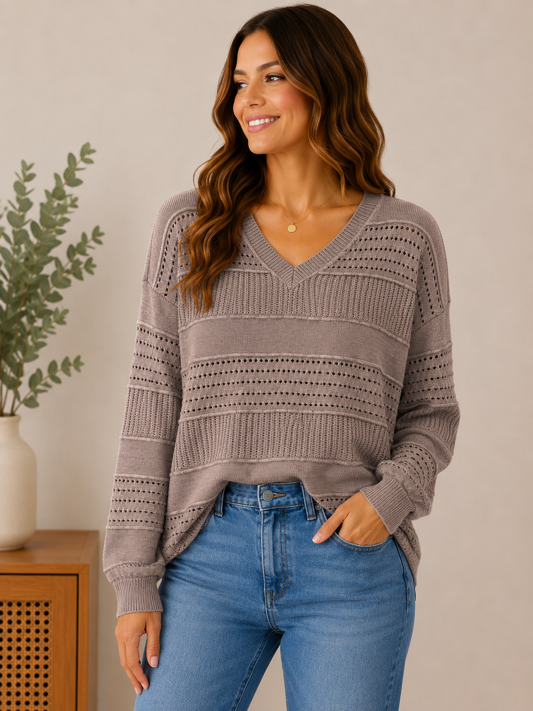 Woman wearing the mocha mist textured v-neck sweater in mocha taupe.